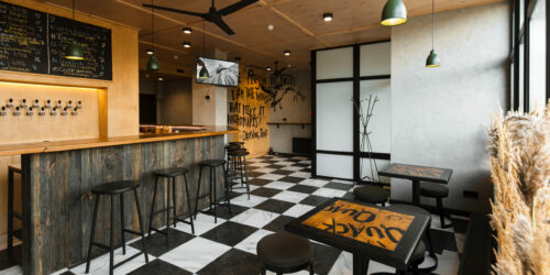 Interior of beer bar with chess tiles and wood. High quality photo